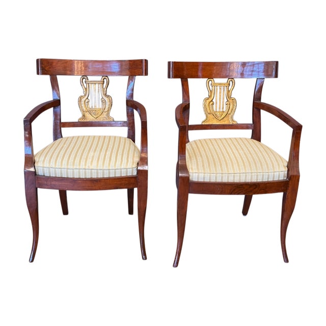 Set of ten dining chairs with shaped tablet crestings above a central gilt-carved lyre splat flanked by swan figures, over...