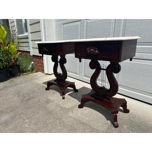 This is a pair of beautiful and rich vintage solid mahogany end tables by Victorian with removable marble tops. The marble...