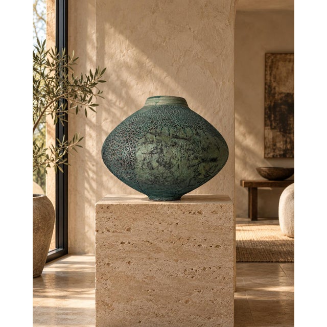 Striking vintage studio pottery vase dated 1984, featuring a sculptural flattened form with a short neck and richly...