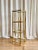 Beautiful brass-plated etagere with 4 glass shelves. Perfect storage furniture to stow your accessories. The square shape...