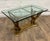 This is a gorgeous vintage late 20th century Regency Neoclassical style wooden eagle base glass top coffee table or...