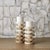 Bring sculptural warmth and natural elegance to any setting with this set of two onyx pillar candleholders, each crafted...