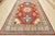 This traditional tribal geometric Caucasian Kazak rug is hand-knotted with an all-wool pile on a cotton foundation. This...