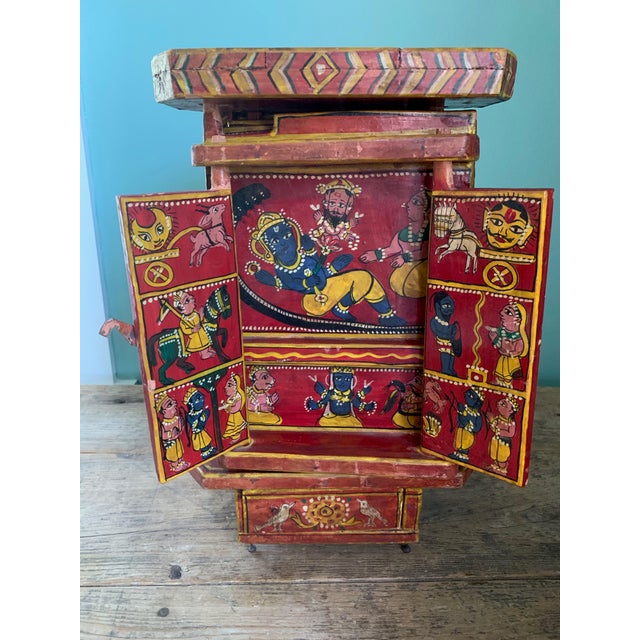 A unique piece! This is an early 20th century Indian re lacquer box completely hand-painted with multiple doors and...