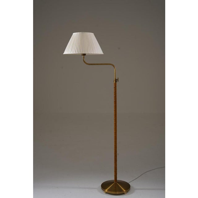 This swedish floor lamp was manufactured by asea in the 1950s and reflects the clean lines and thoughtful functionality of...