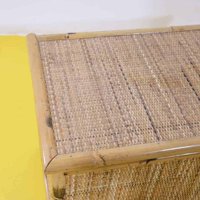 Wood and bamboo chest with woven storage cover.