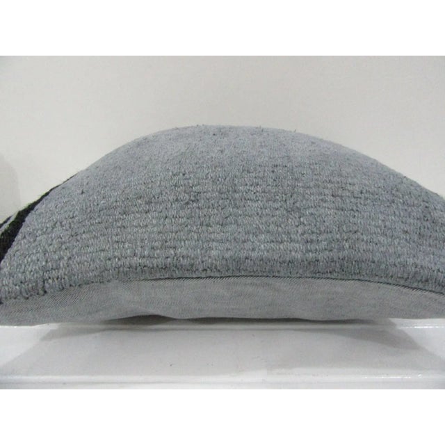 This is a pillow cover made from a vintage kilim rug. The piece was properly washed and ready to use. Pillow inserts not...