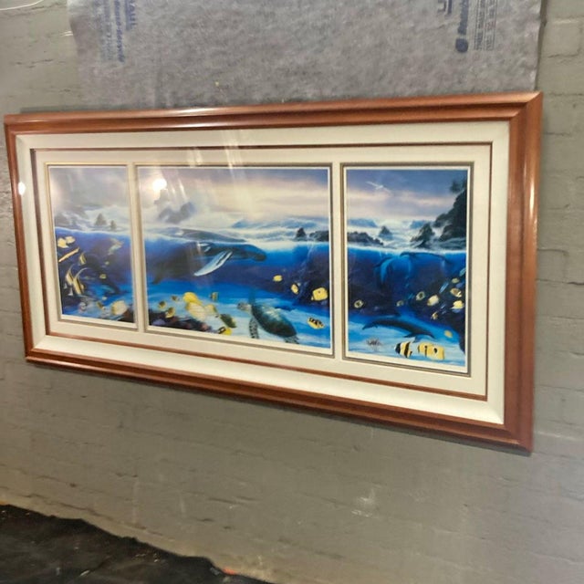 This beautiful framed triptych features a vibrant underwater scene with whales, colorful fish, and sea turtles. The three-...