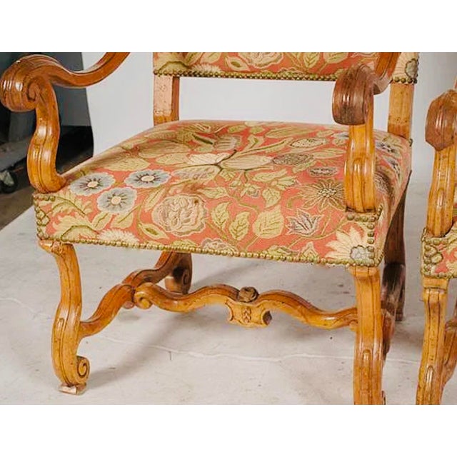 Pair of Antique French Louis XIII–XIV Style Walnut Armchairs, Newly Upholstered A wonderfully decorative pair of antique...