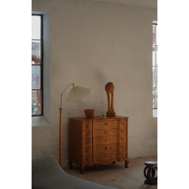 A characterful chest of drawers in the style of Henning (Henry) Kjærnulf, crafted in oak and made in Denmark in the 1960s....