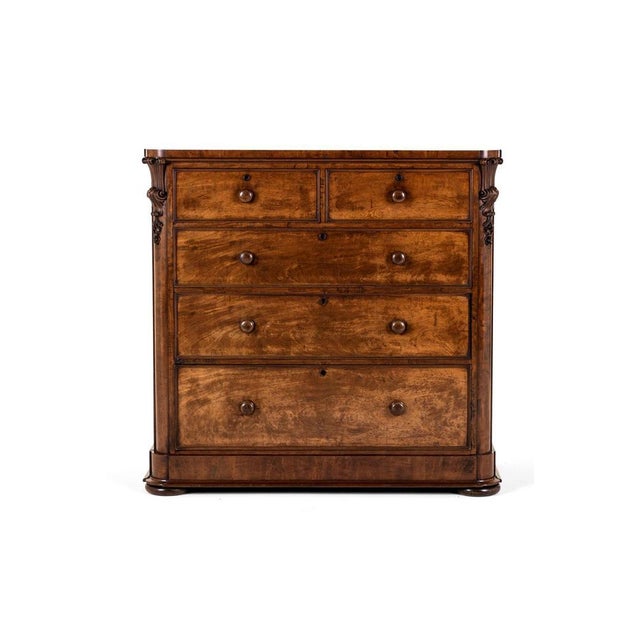 An exceptional early victorian mahogany chest of drawers with an arrangement of two over three long drawers. The smooth...