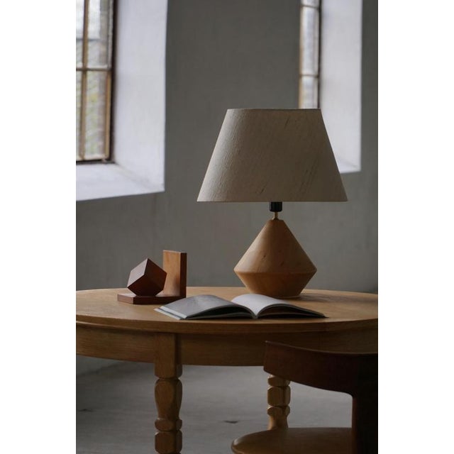 This beautiful sculptural table lamp comes from the Danish family-owned woodturning company Kirk and was crafted in the...