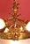 Detailed chandelier made of solid polished brass made around 1900. The chandelier is heavy. Hand-cut lower shade....