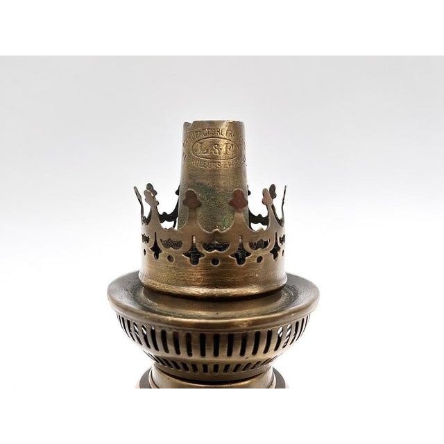 This authentic French oil lamp, dating from the late 19th to early 20th century, features a high-quality Lempereur &...