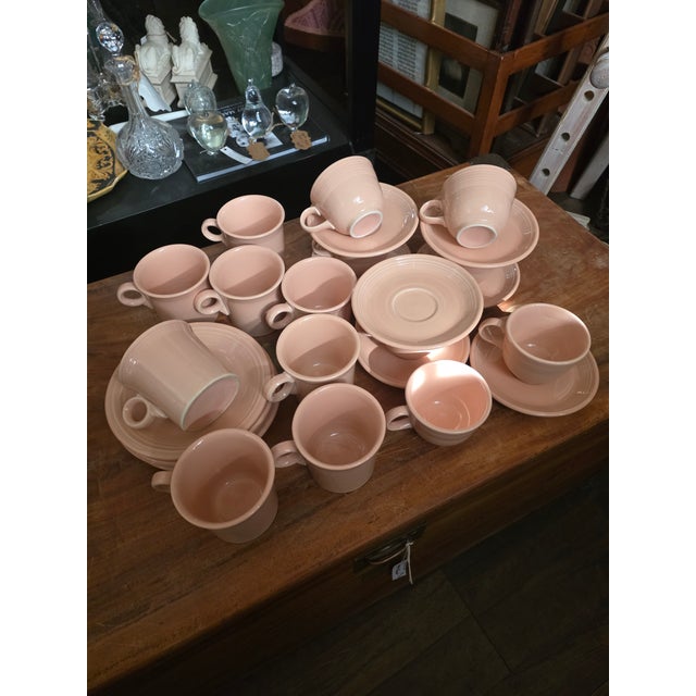 Great group of retired "Rose" color Fiesta ware by Homer and Laughlin. Four 7.25" plates. 8 coffee mugs 5"w, 3.75 d and...