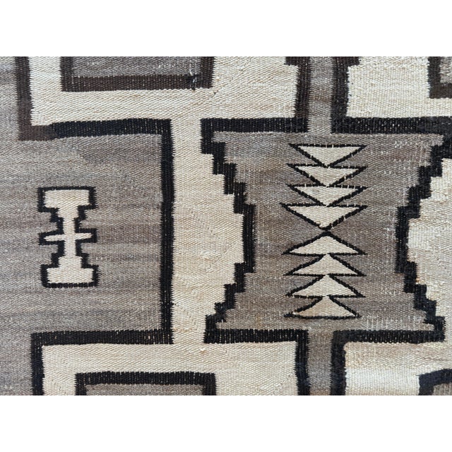 This antique Navajo rug, circa 1890, is a striking example from the Transitional Period (roughly 1880–1910) in Navajo...