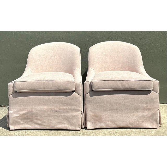 Elevate your living space with this charming pair of vintage Lee Industries tub chairs. Defined by their graceful, curved...