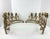 An unusually sculptural pair of gilt wrought-iron candelabra featuring an elaborate botanical design of sweeping stems,...