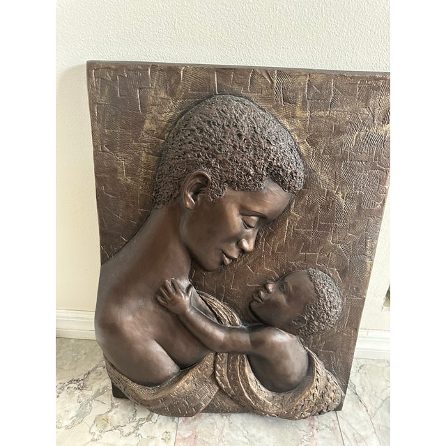 Bonded Bronze wall sculpture (hanging) by Bill Mack titled Devotion. Artwork depicts Mother & Child with a raised 3...