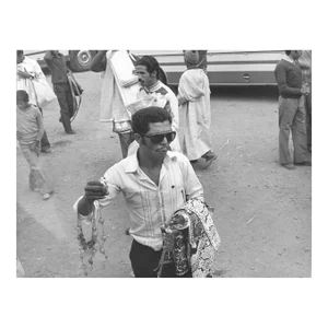 1976 Moroccan Street Vendor Photograph by Don Ware