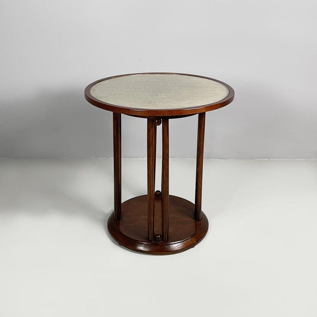 Austrian wood, fabric and glass coffe table by Jacob e Josef Kohn, 1930s Coffee table with wooden frame. The round...