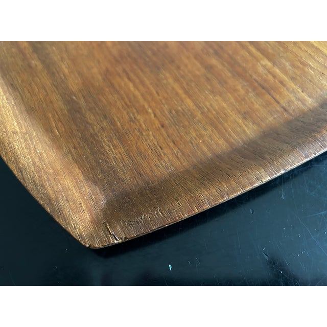 Teak tabletop produced by Ary Nybro in Sweden in the 1960s. It is made of pressed teak veneer. This piece has an...
