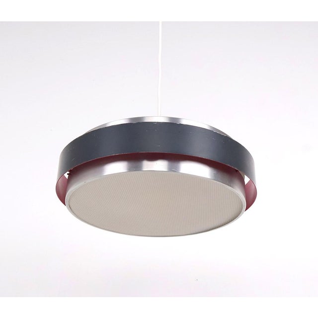 Vintage danish design pendant lamp by fog & mørup, designed by jo hammerborg in the 1960s, model “sera”. the lamp has a...