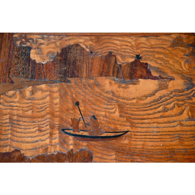 This charming double-tiered tea table dates from the 1920s. In a console style, it consists of a tabletop and a shelf...