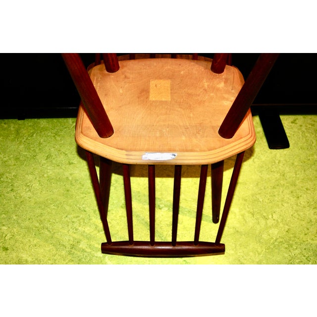 A quartet of iconic designer chairs in solid teak; these Danish pieces combine the tradition of the Windsor chair with...