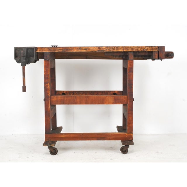 Vintage Industrial woodworkers' workbench with two functional vises, dog holes, and a parts tray. The hardware is made of...