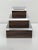 Set of three Macassar Ebony and Lucite jewelry boxes. Measures: Large box 9"by 9" by 3.75". Medium 7" by 7" by 3.25"....