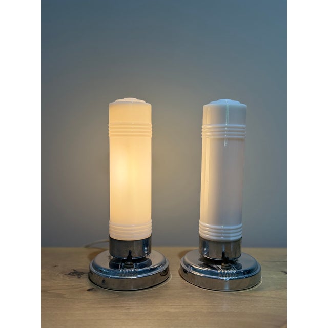 A striking and increasingly difficult-to-find matched pair of Art Deco Streamline Moderne accent lamps, dating to the...