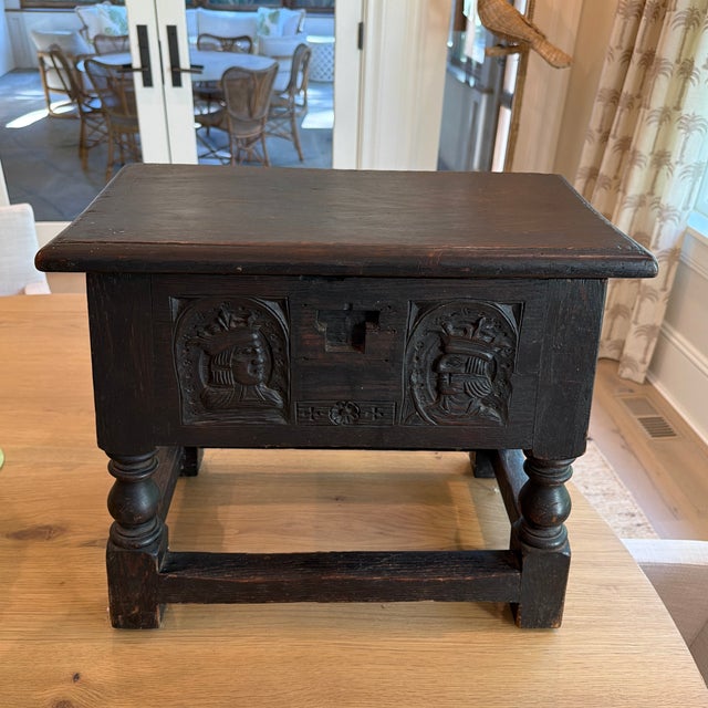Charming antique European carved oak chest on stand, featuring wonderfully expressive figural and floral carving and a...