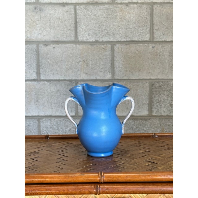 Beautiful earthenware vase in a stunning blue with handles. Great form and color. Beautiful piece that would work well in...