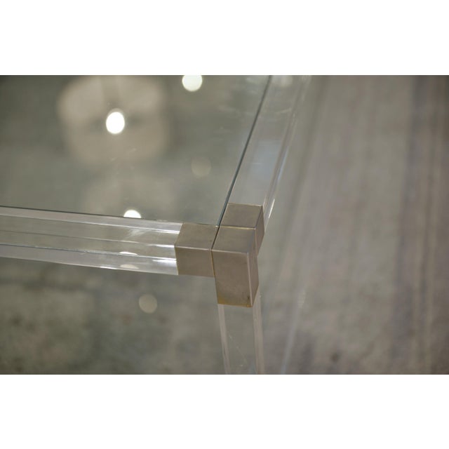 Large two-tiered coffee table in polymethyl methacrylate (PMMA), France, 1970s. The fully transparent structure with...