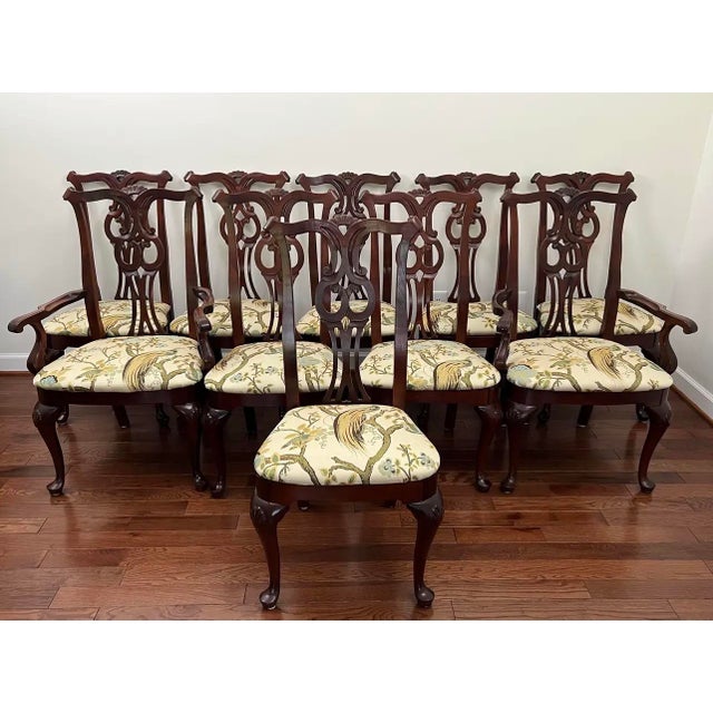Set of 10 Chippendale dining chairs, including 2 armchairs and 8 side chairs, by Century Furniture Company. Chairs are...