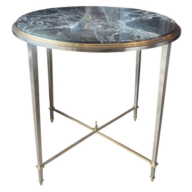 An elegant pair of French side tables Attributed to Maison Jansen , exemplifying the firm’s refined approach to...