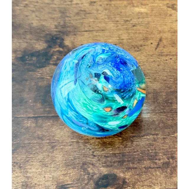 1999 vintage hand-blown art glass paperweight by studio artist Jim Karg. The distinctive "Aquatone" ocean swirl styling,...