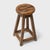 This rustic wooden stool from China's Shanxi province charms with its compact scale and timeworn texture. Crafted with...
