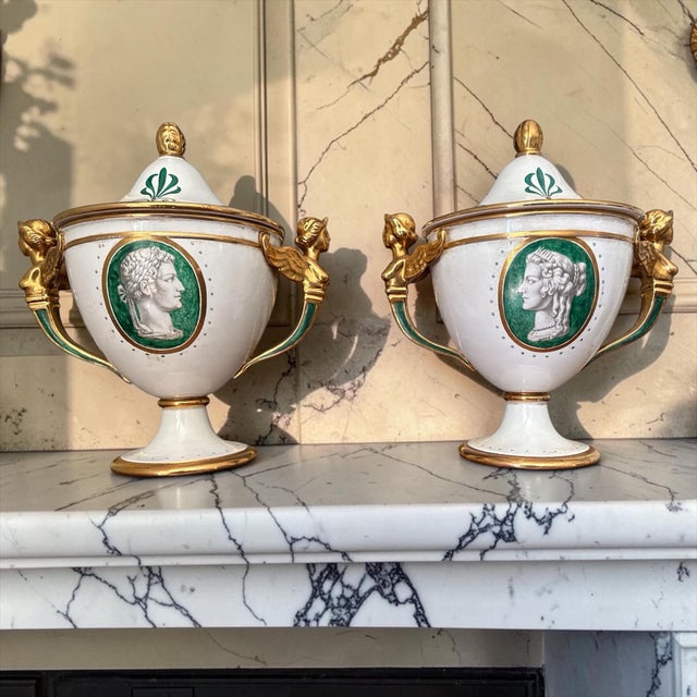 A striking pair of mid-20th century Italian ceramic urns by Ugo Zaccagnini, Florence, executed in a refined neoclassical...