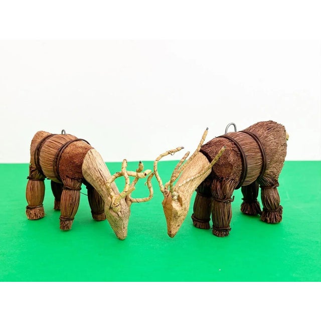 Adorable vintage 1970s pair of handcrafted deer figurines/ornaments of bundled and wire banded straw bodies and hand...
