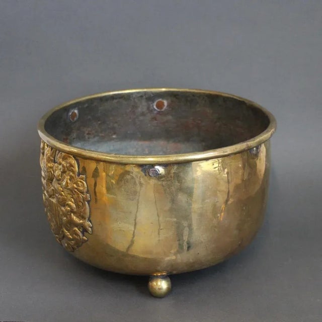 Antique three-legged French brass cachepot (circa 1700s). This piece has a fascinating connection with historical figures....