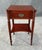 This vintage one-drawer nightstand features a warm wood finish, accented by elegantly fluted legs and rounded corner...
