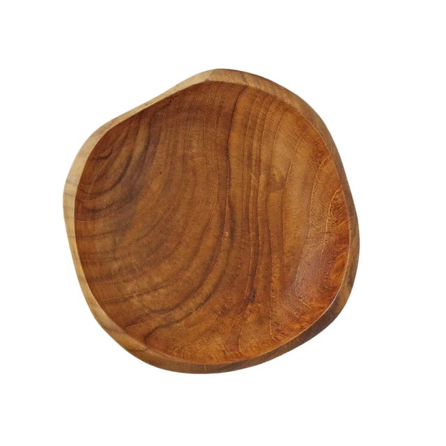 Simple sanded smooth teak wood bowl with unique wave design top edge. Each unique in exact natural tones and grain and...