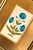 This beautiful blue floral motif painting draws inspiration from the iconic designs of Jaipur, India, seen gracing the...