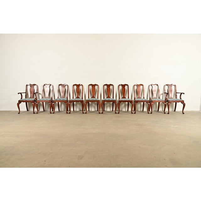 An outstanding set of ten Queen Anne or Georgian style dining chairs By Henkel Harris USA, Circa 1970s Solid cherry wood...