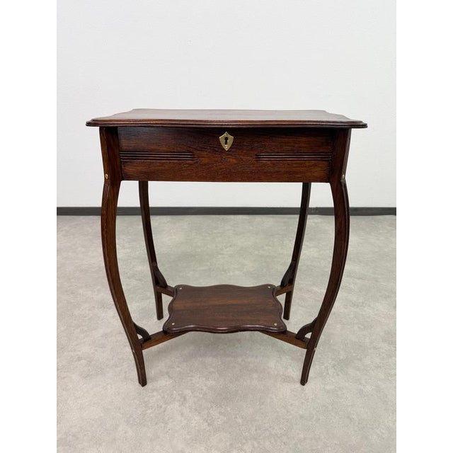 Elevate your space with this stunning antique vanity and sewing table, crafted in the elegant style of the Vienna...