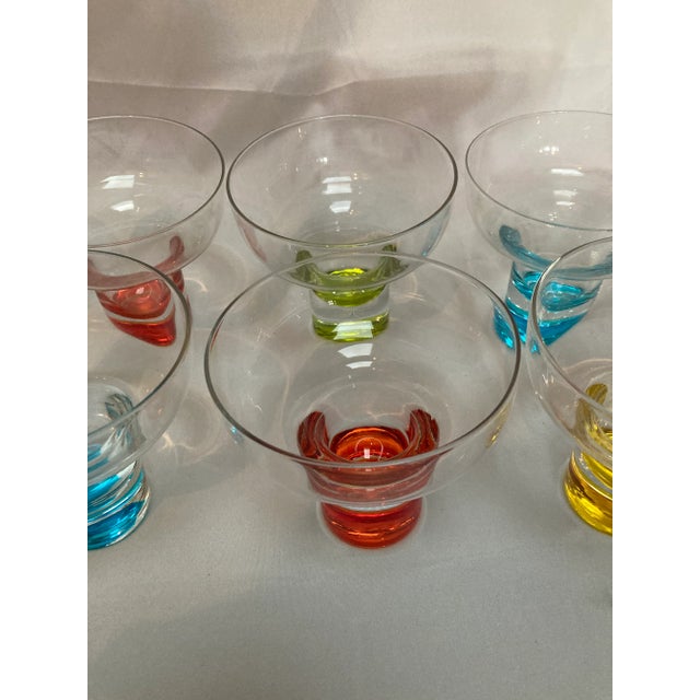 Very nice multi color cocktail glasses with a unique shape. This a set of 8 in very good condition.