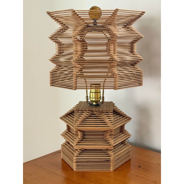 Midcentury Folk Art table lamp with an orange glass mosaic finial, professionally rewired. Popsicle stick construction in...