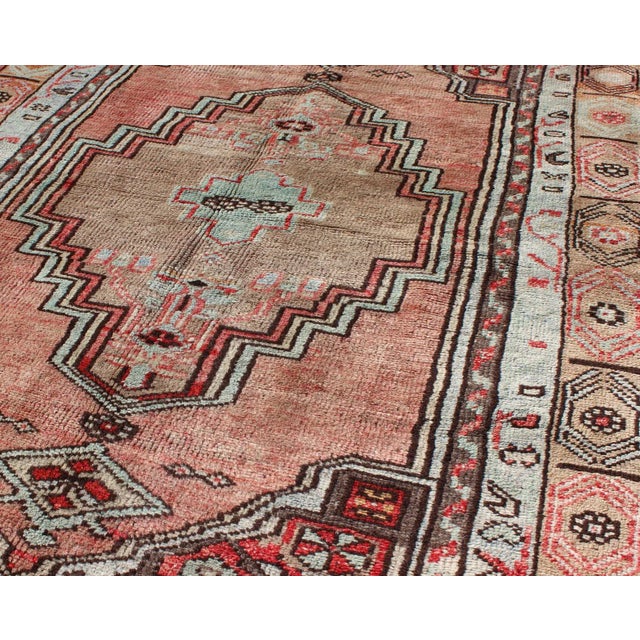 Mid 20th Century Salmon and Pink Vintage Turkish Oushak Rug With Tribal Medallion Design For Sale - Image 5 of 7